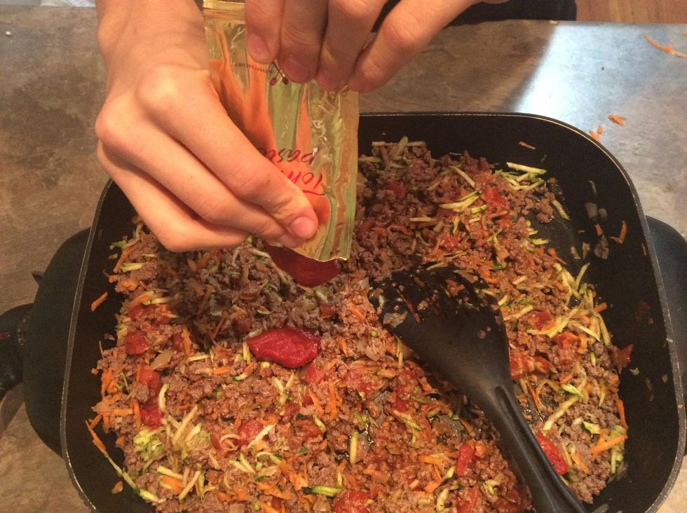 Add tomato paste sachets.