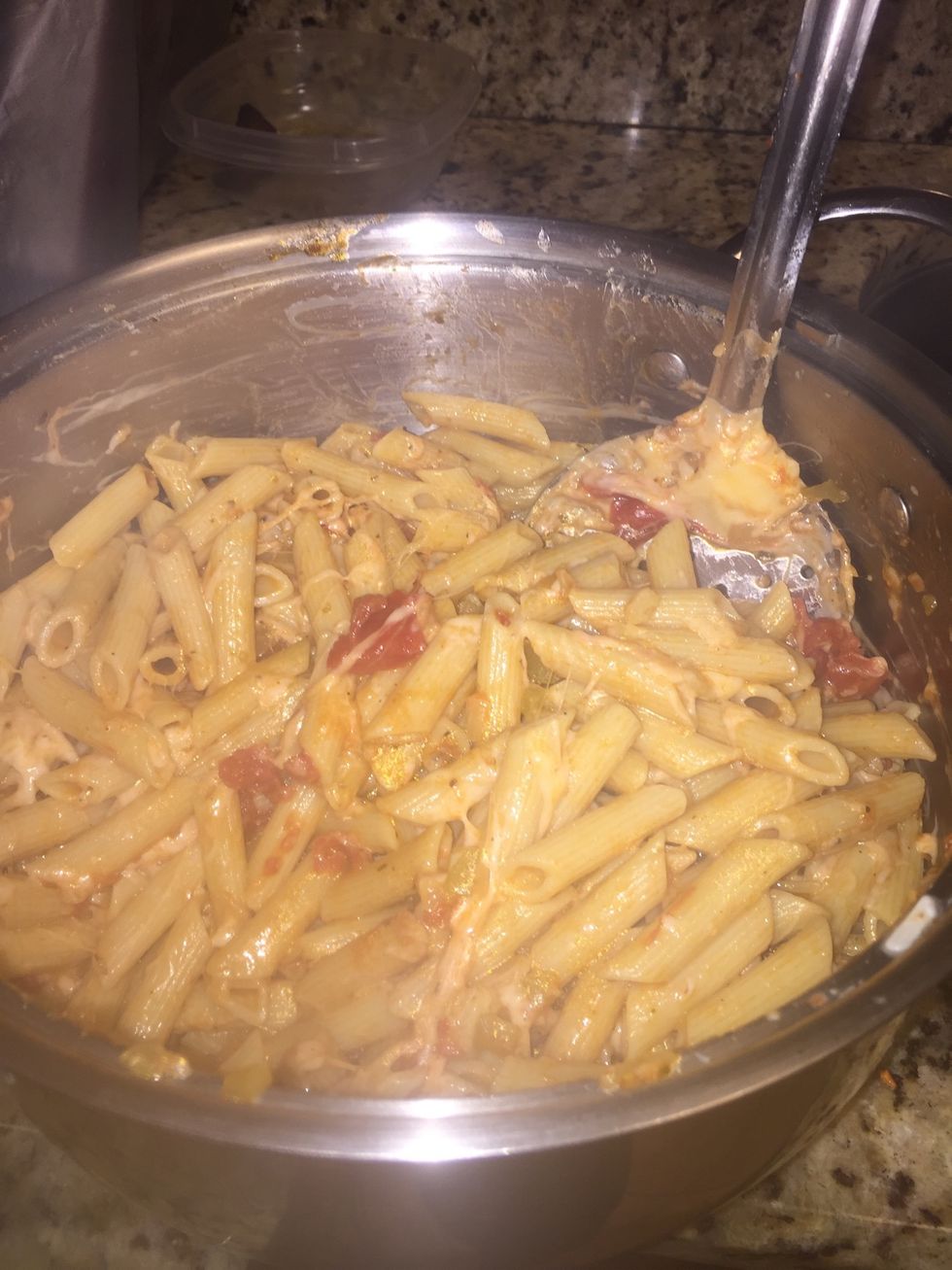 Add tomato sauce and cheese to pasta and toss over low heat until cheese is melted