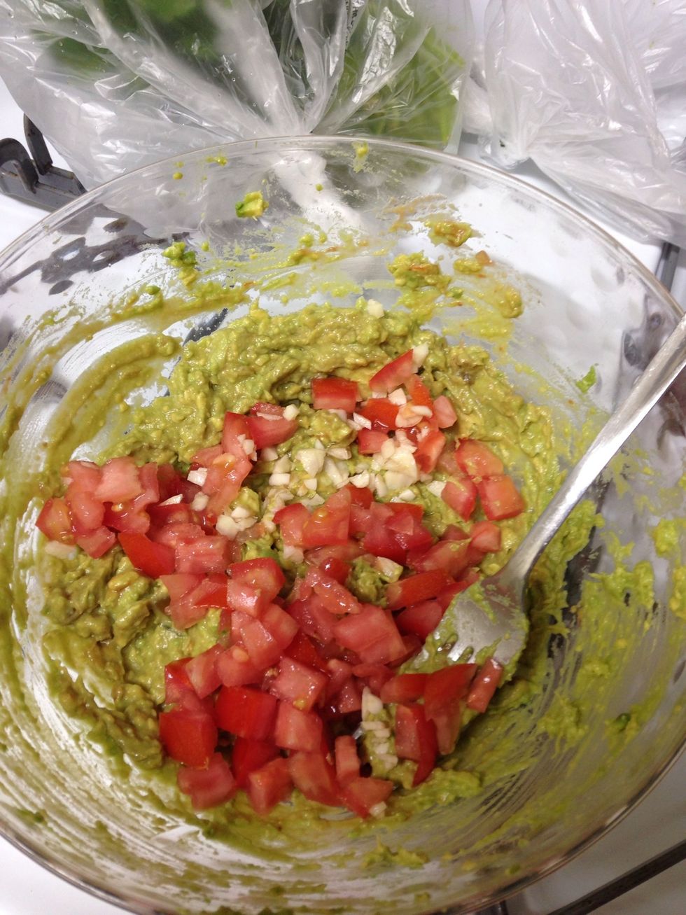 Add tomatoes and garlic- mix.