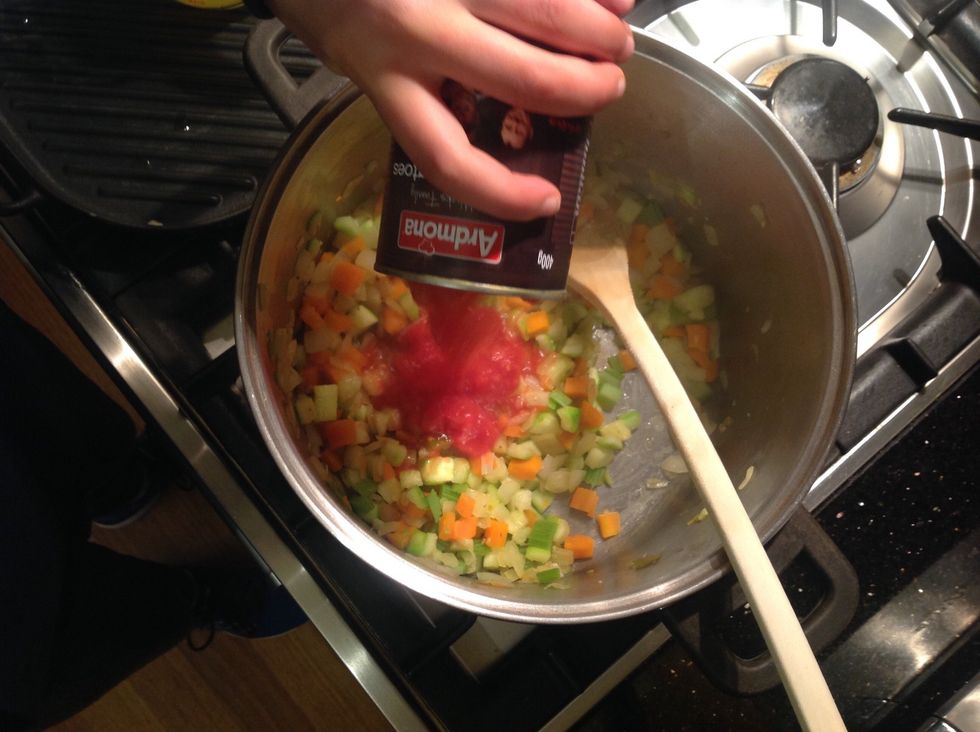 Add tomatoes and vegetable stock. Cover and bring to the boil. Reduce heat to medium low. Note: have the pot lid partly closed. Cook for 15 minutes.