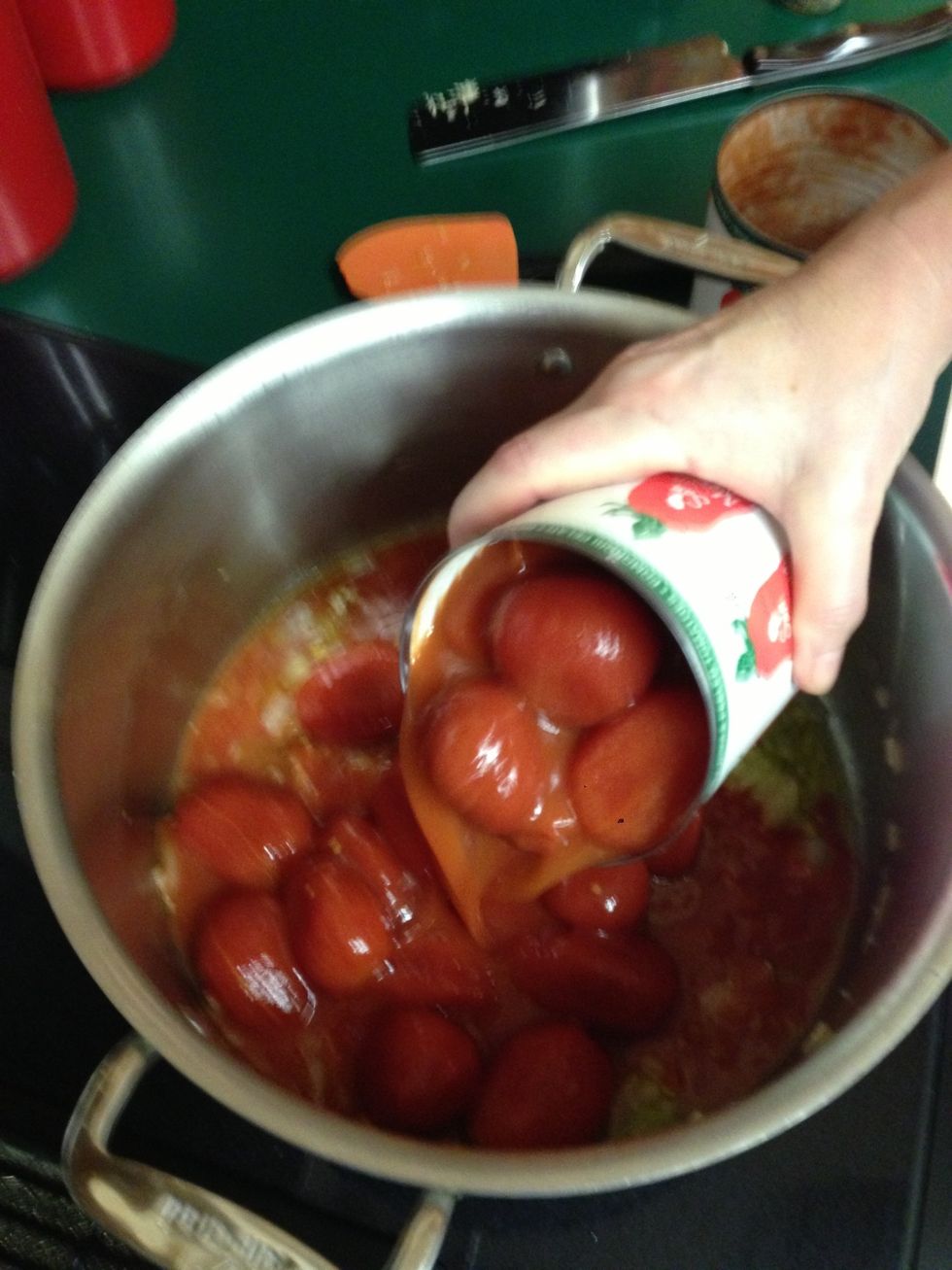 Add tomatoes.  For these whole tomatoes, pop them by hand.