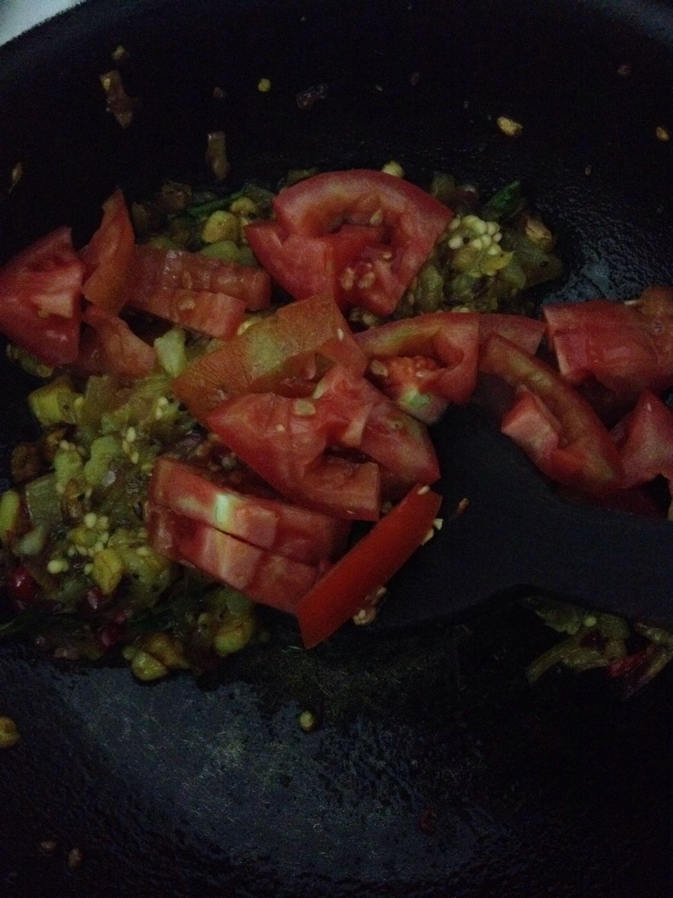 Add tomatoes to it