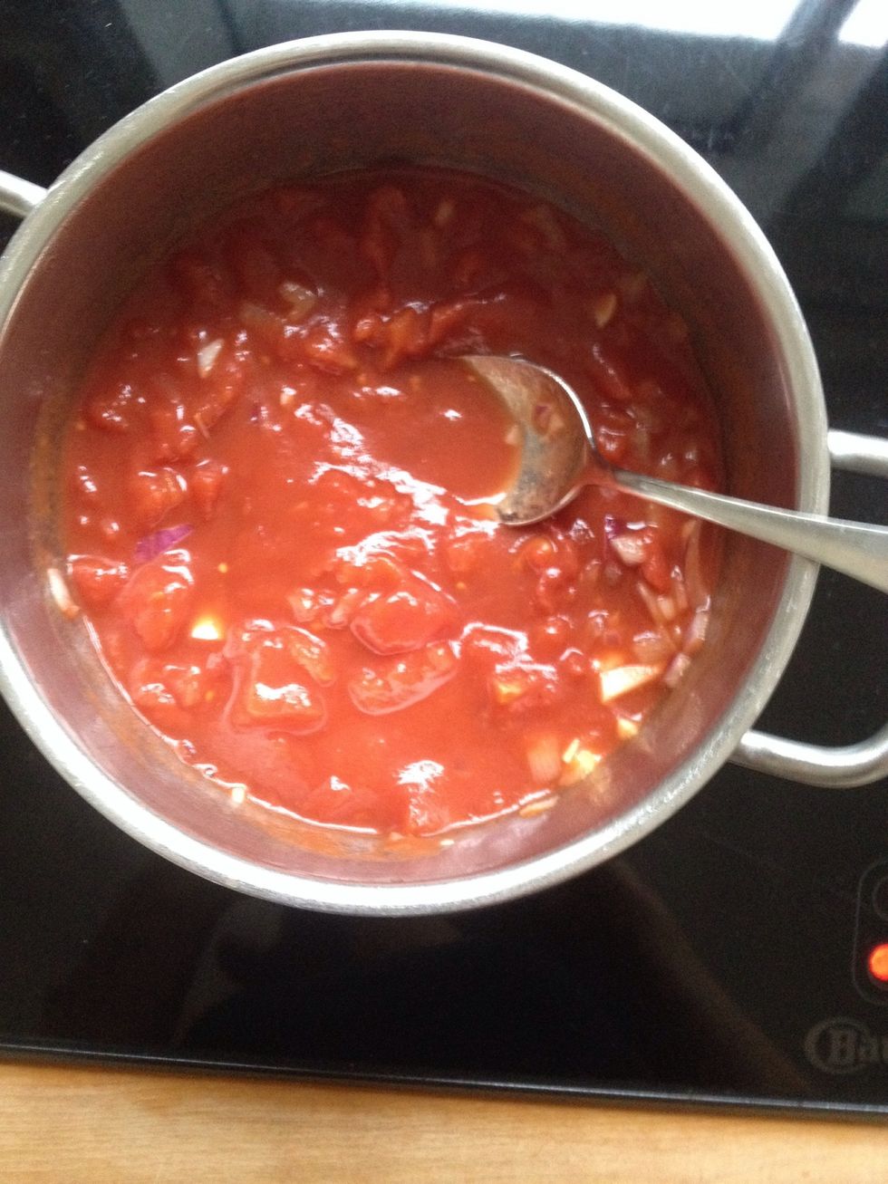 Add tomatoes to the garlic and onion.