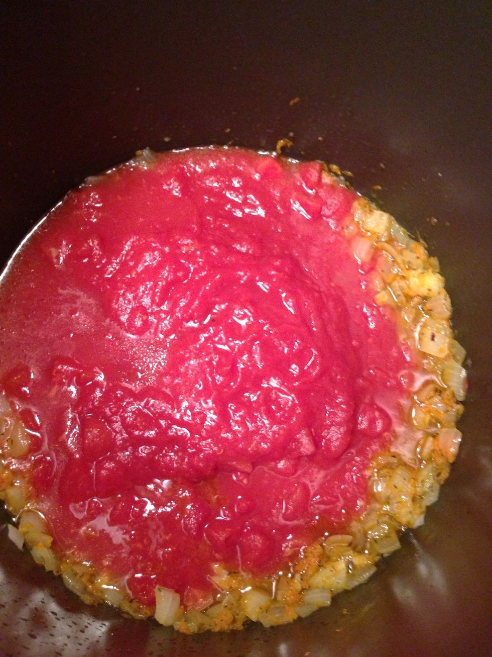 Add tomatoes to the pot.