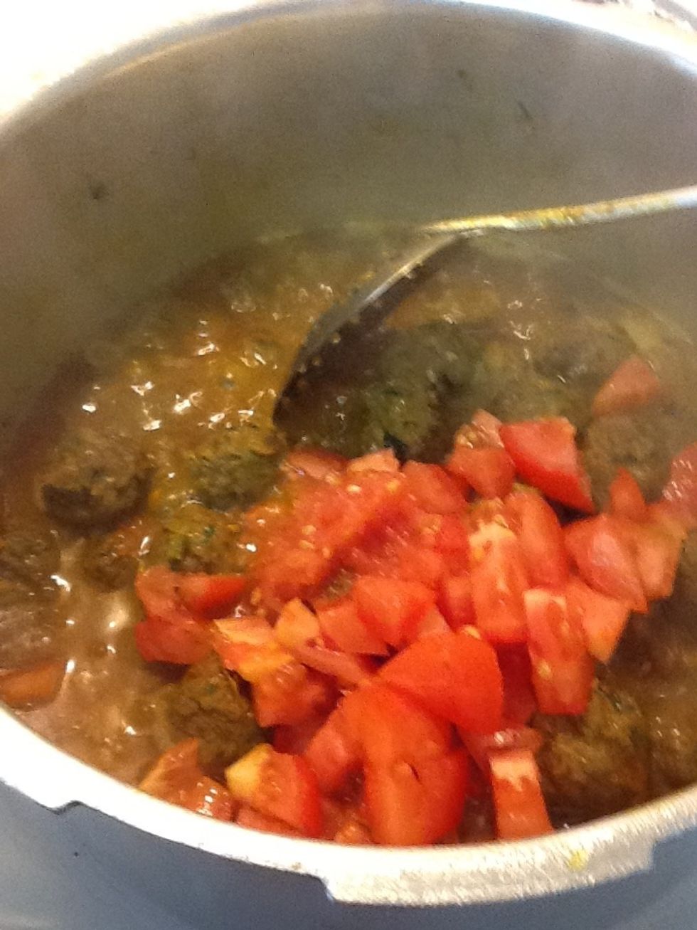 Add tomatoes to the sauce