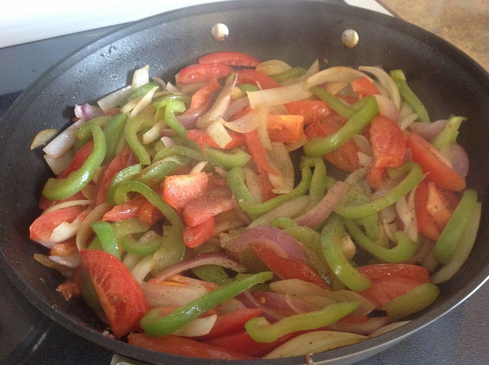 Add tomatoes to vegetables once they are cooked