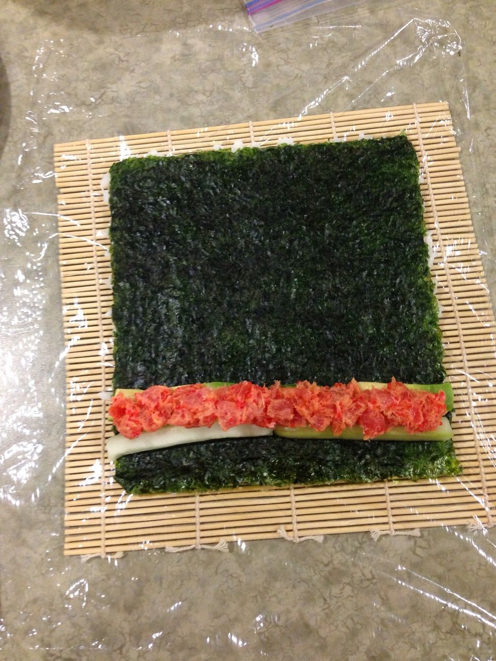 Add topping and while you roll it up pull plastic wrap out at the same time (this takes practice)