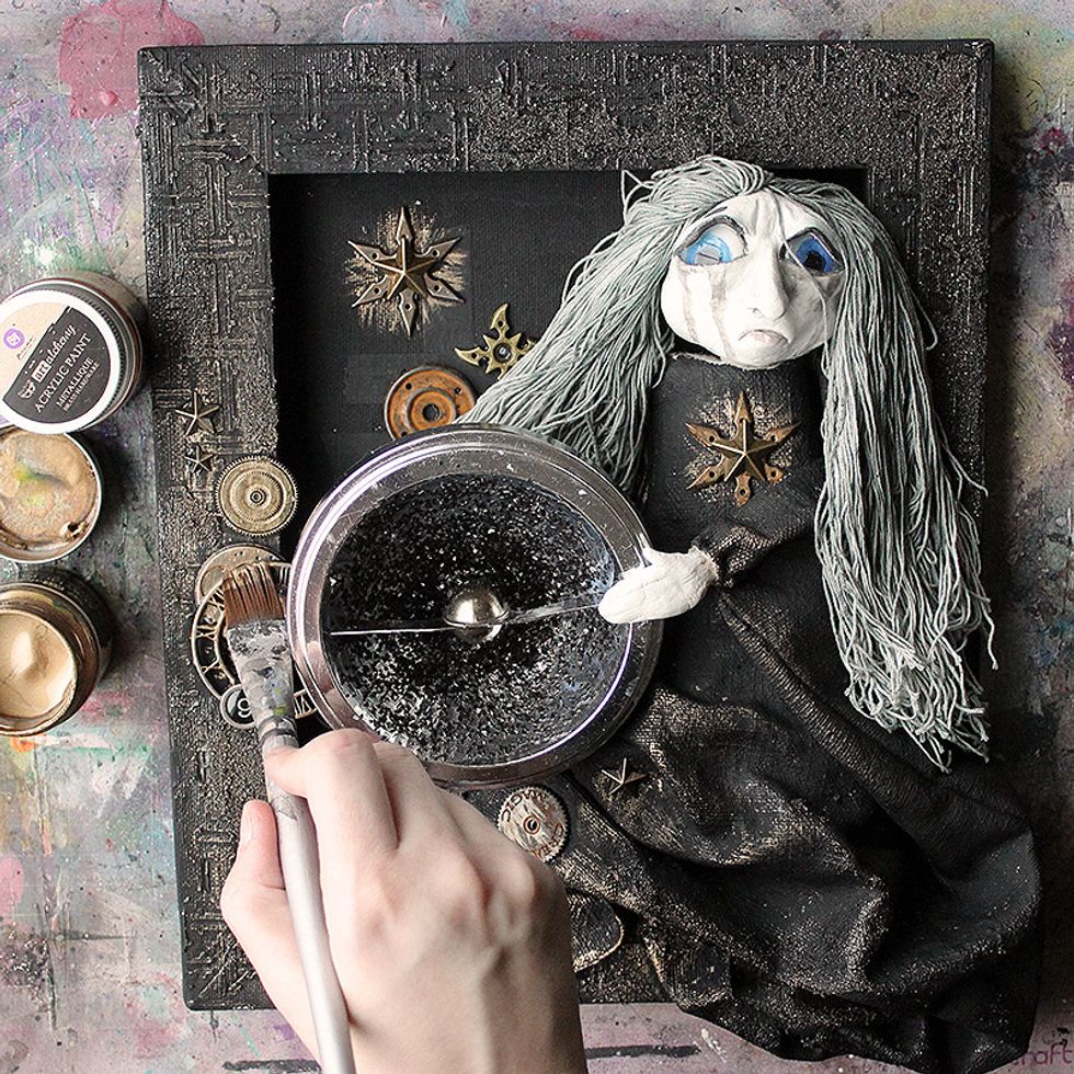 Add touches of metallic using the Art Alchemy paint.