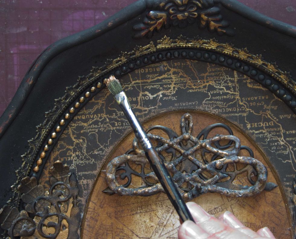 Add touches of "Steampunk Copper" to highlight the decorative elements on the frame: