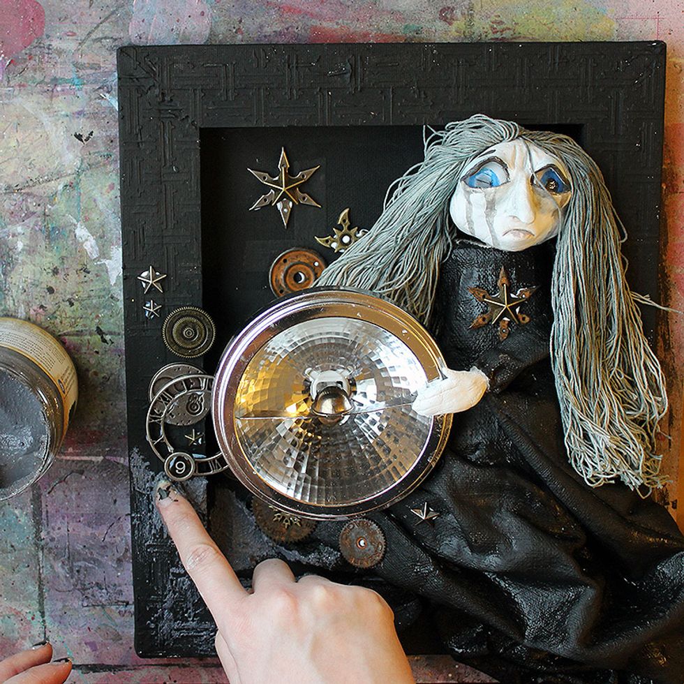 Add touches of the Graphite Texture Paste here and there. You can use a brush or palette knife also.