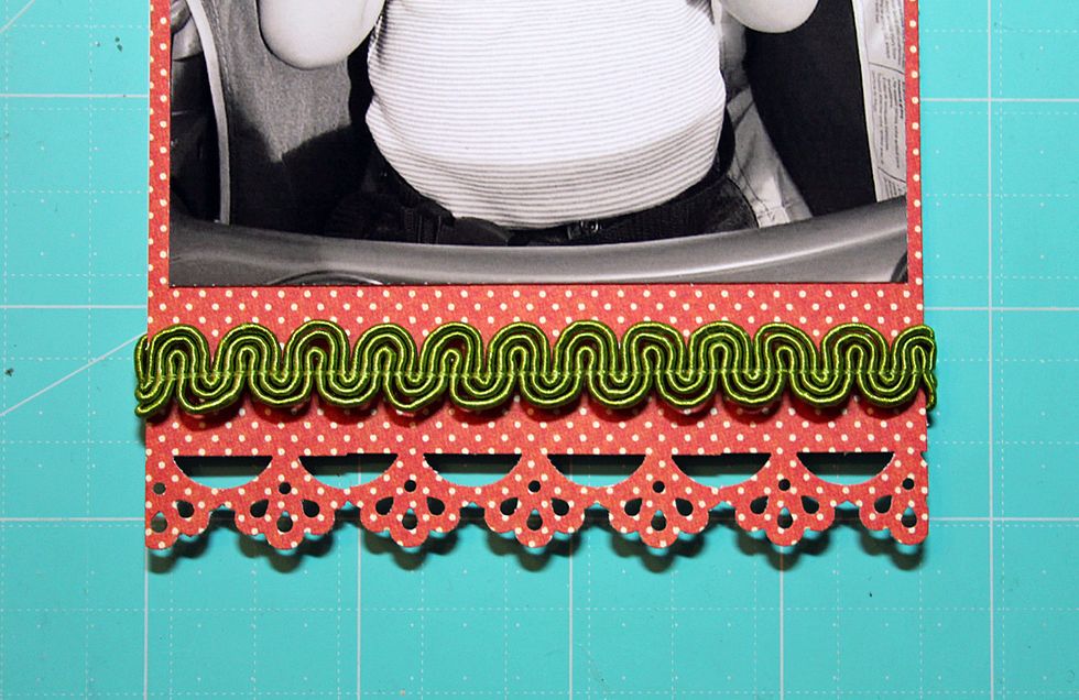 Add trim above the punched design as shown. Add the photo to the center of the mat on the layout base.  Add chipboard title to the lower, right side of the photo.