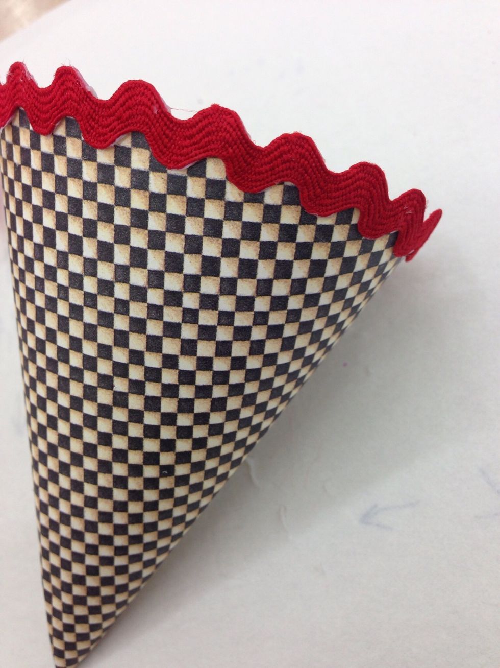 Add trim to the bottom of the roof or add a fancy edge with decorative scissors.