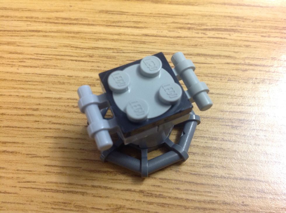 Add two 1x2 with the beams on the side and put a spin-a-thing on top. (Sorry, I don't know all the names :p)