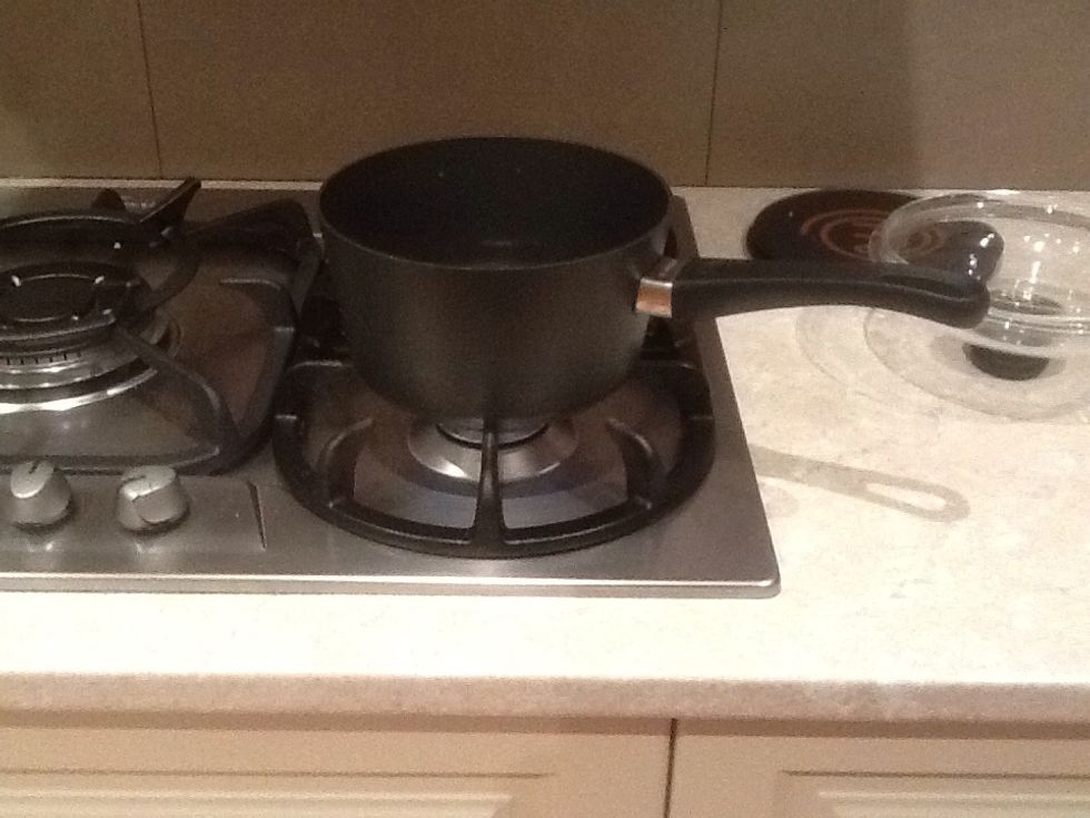 Add two and a half cups of water to boil the rice. Also put half a tea spoon of salt in the water. Place rice in pot to boil.