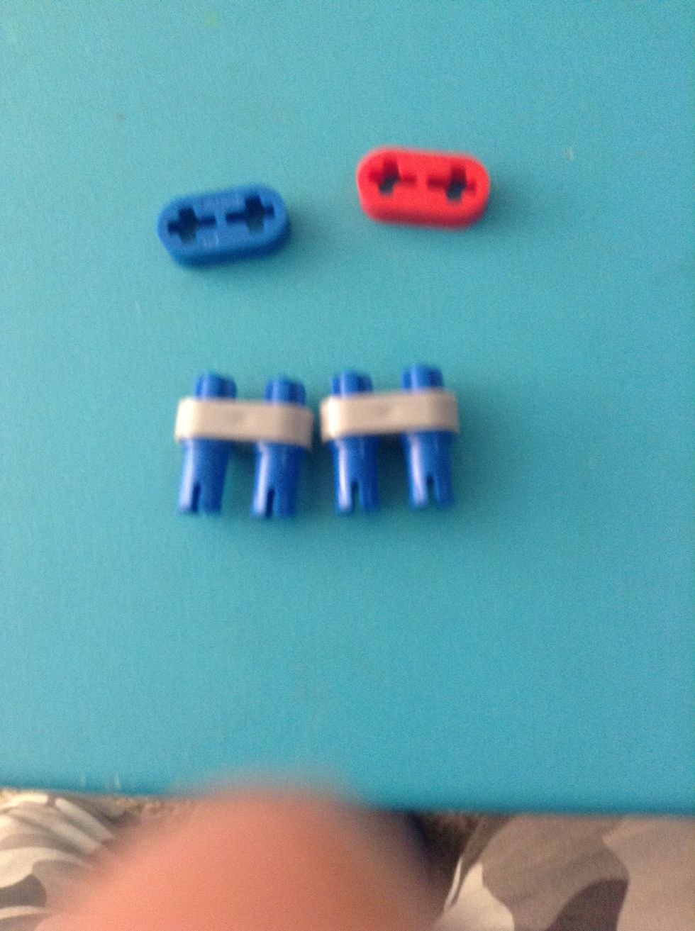 Add two axle pegs to each grey slide on thing