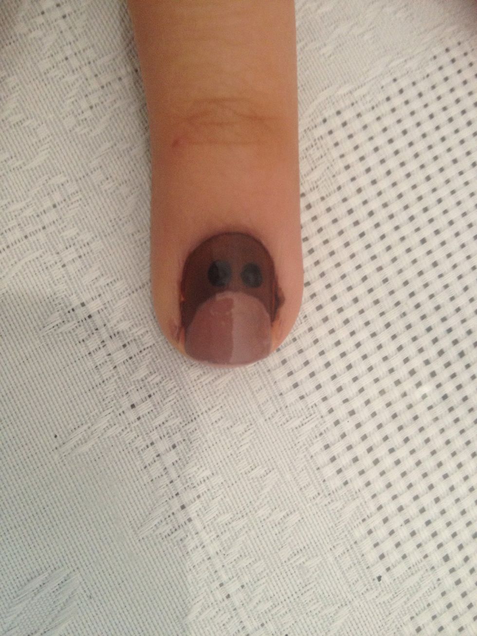 Add two black dots. Those will be his eyes.