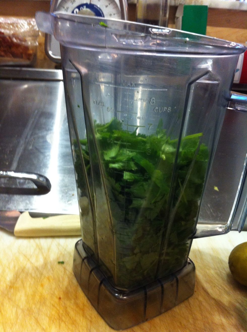Add two bunches of cilantro into the vitamix