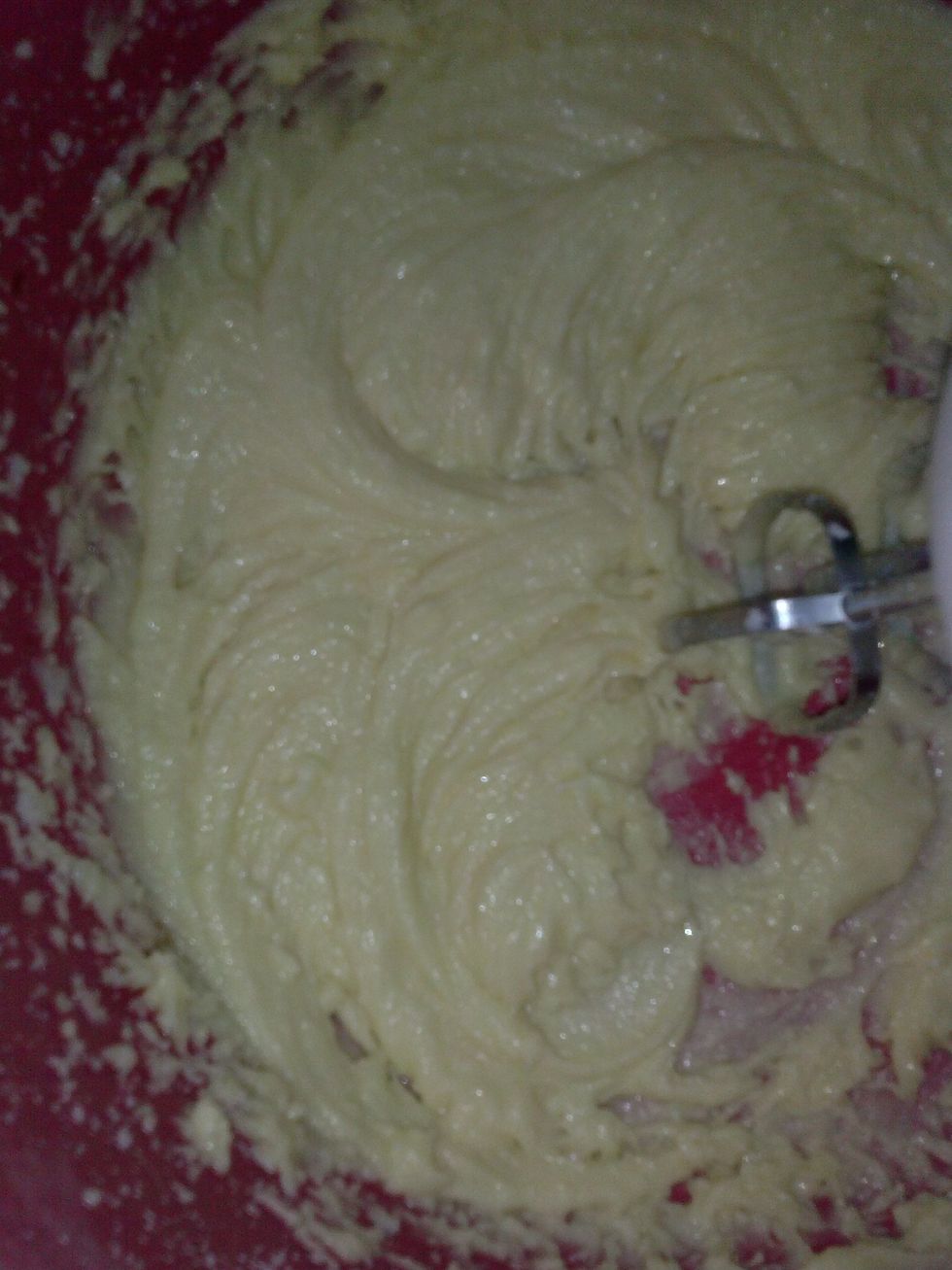 Add two eggs one at a time. Then scrape down the sides and add the vanilla extract and beat till its all combined.