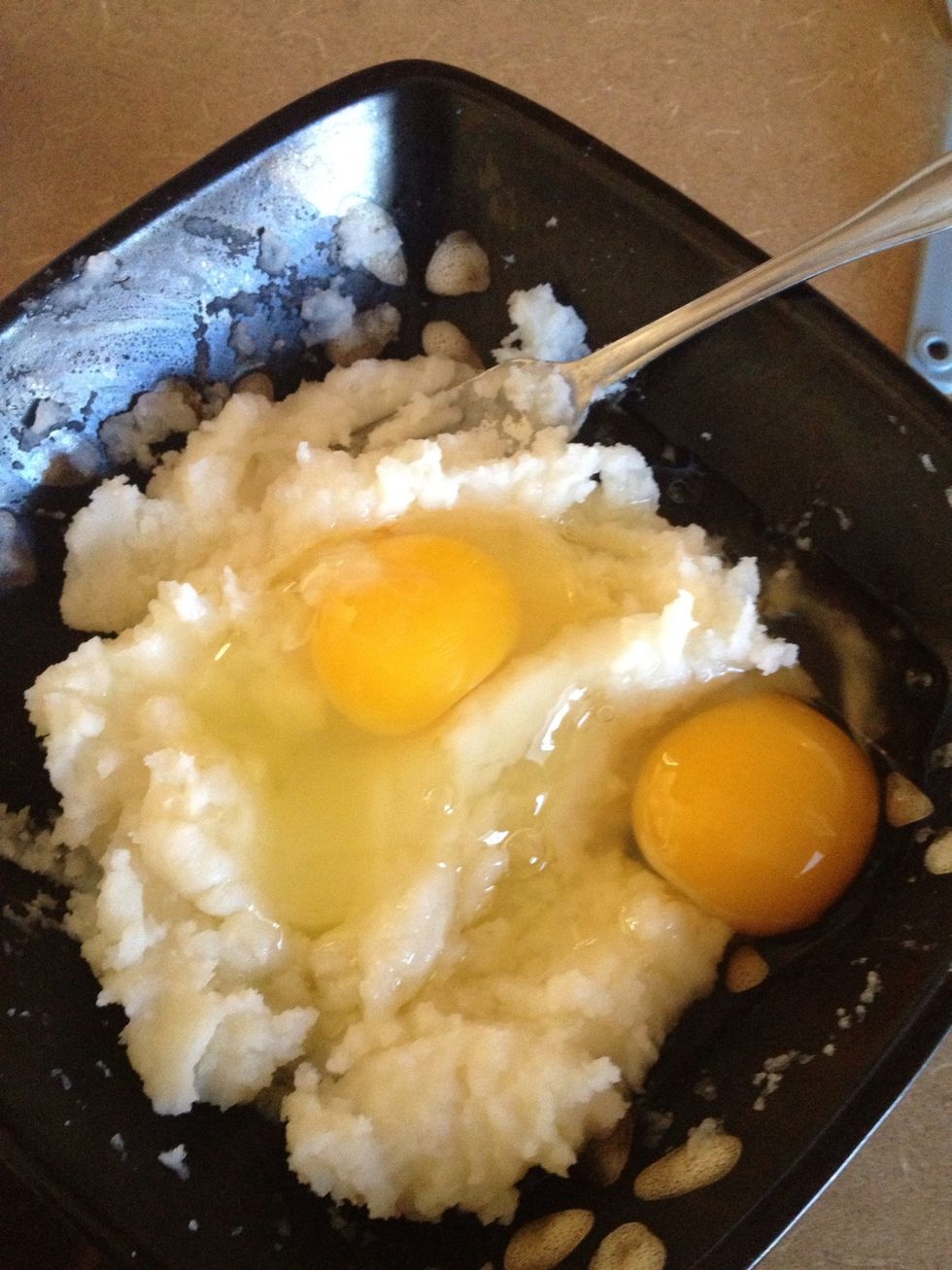 Add two eggs to potatoes
