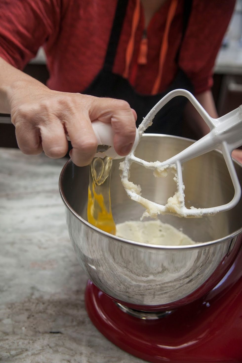 Add two eggs to the butter and sugar mix.