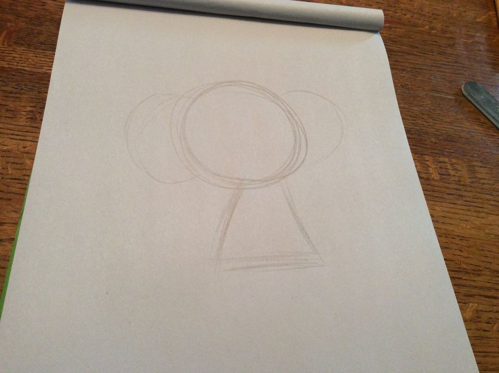 Add two half circles and a triangle at the body