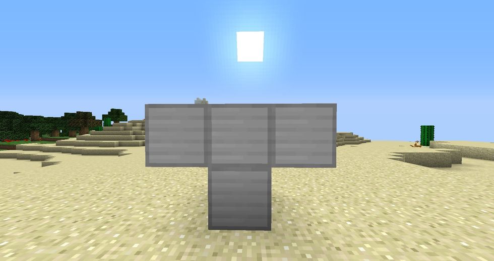Add two iron blocks in the shape of a T.  There is no necessary order in which the side blocks need to be placed in.