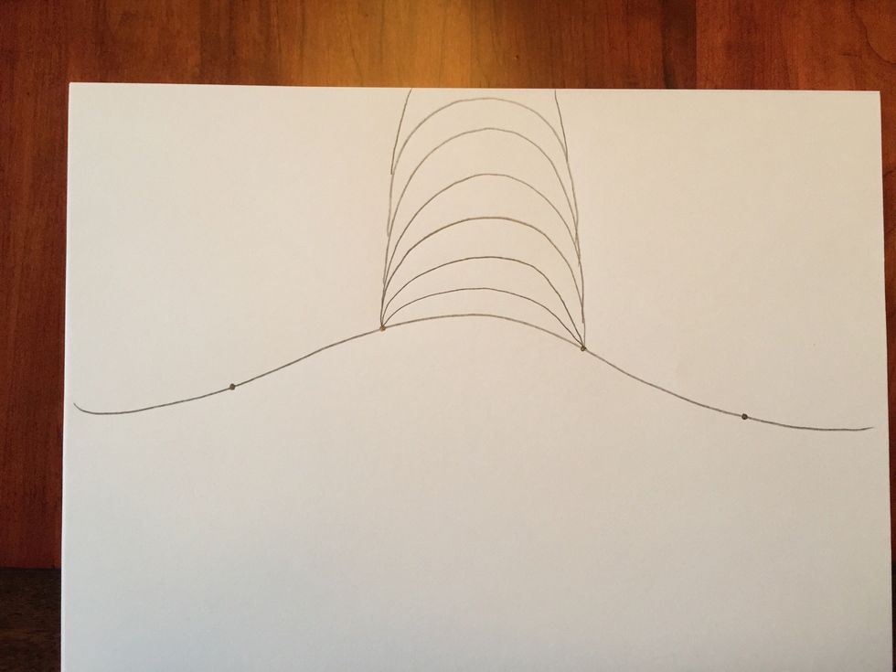 Add two lines from each side of your last curved line and draw them going off the top of your paper.