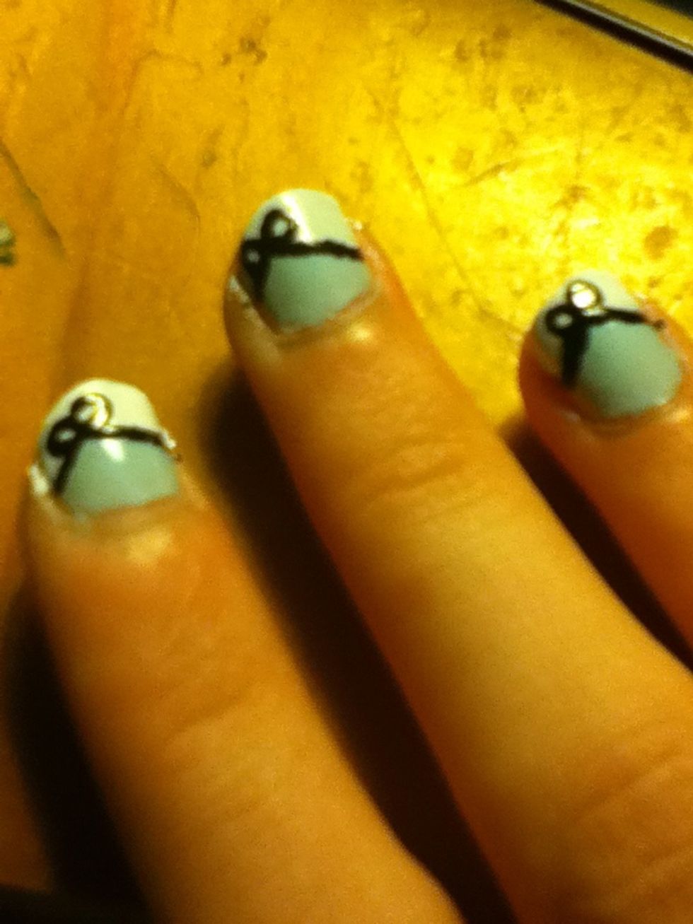Add two little circles as a bow.