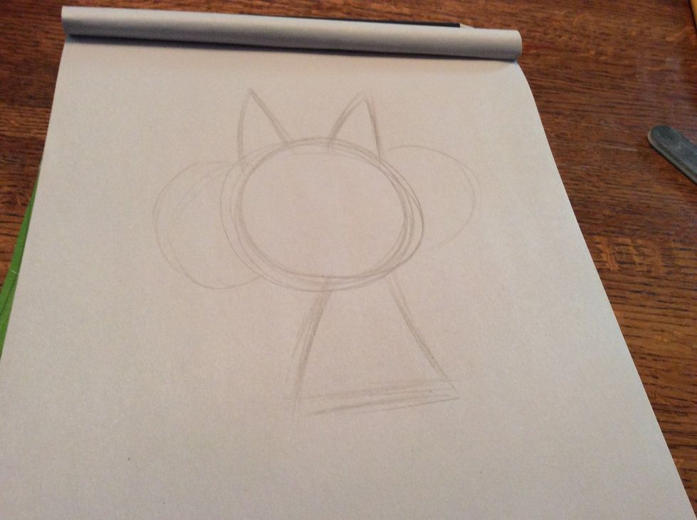 Add two more small triangles at the top