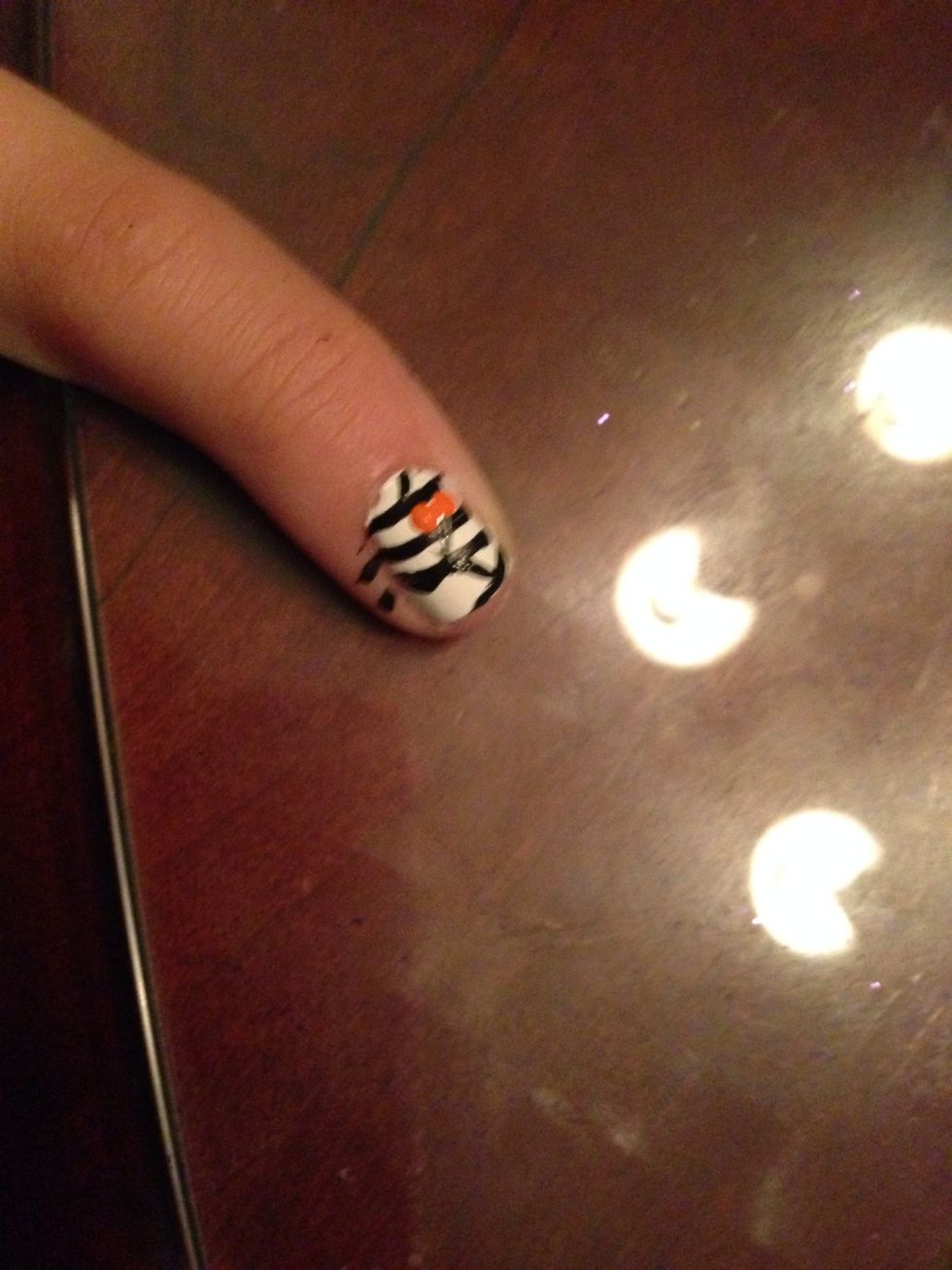 Add two orange dots then little black ones on top
