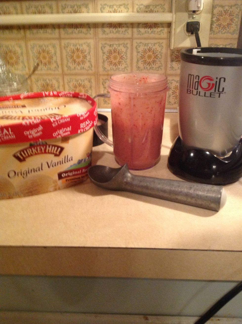 Add two scoops of vanilla ice cream.