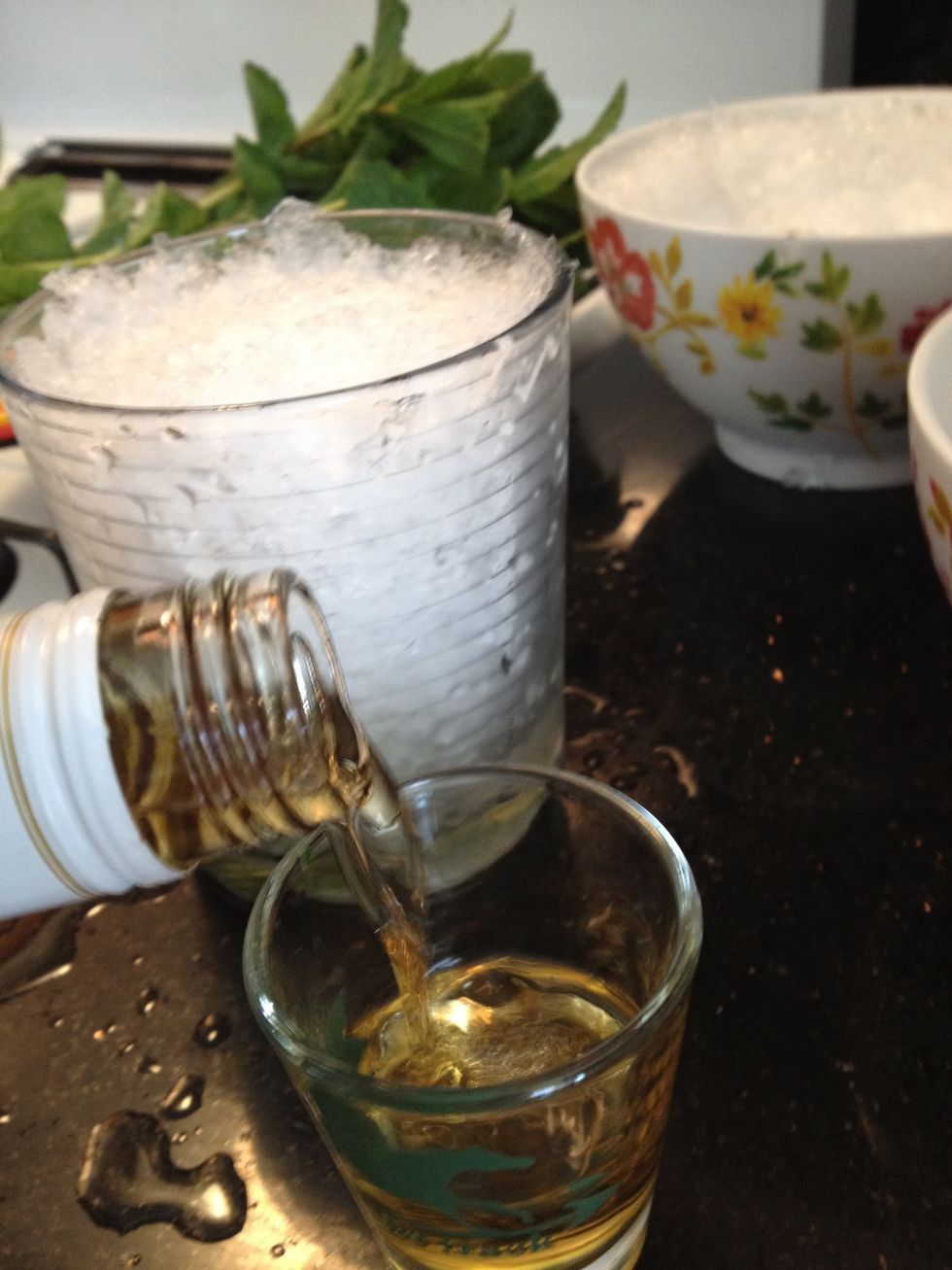 Add two shots of bourbon. It's traditional to use Evan Williams, but any bourbon that costs between $10 and $24 a fifth will turn out just fine.