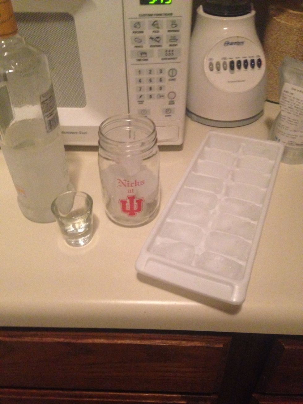 Add two shots of Passion Fruit vodka to glass with ice cubes