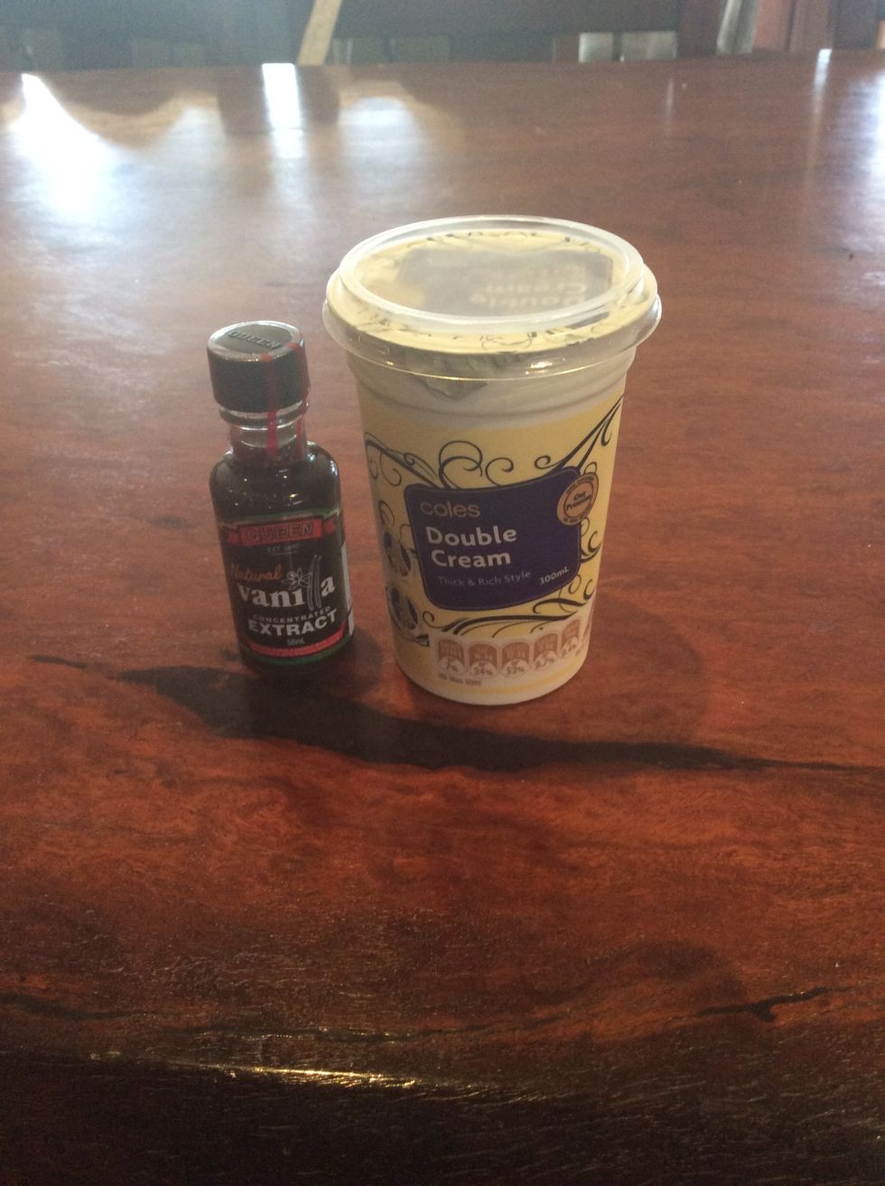 Add vanilla extract and cream to a bowl and beat.