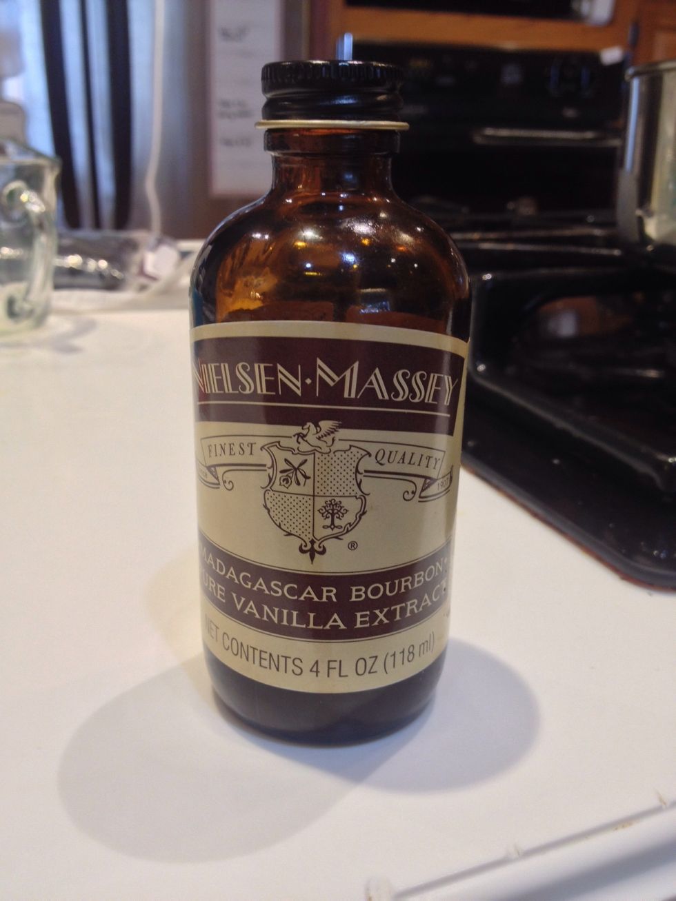 Add vanilla extract to taste to the milk in the sauce pan.