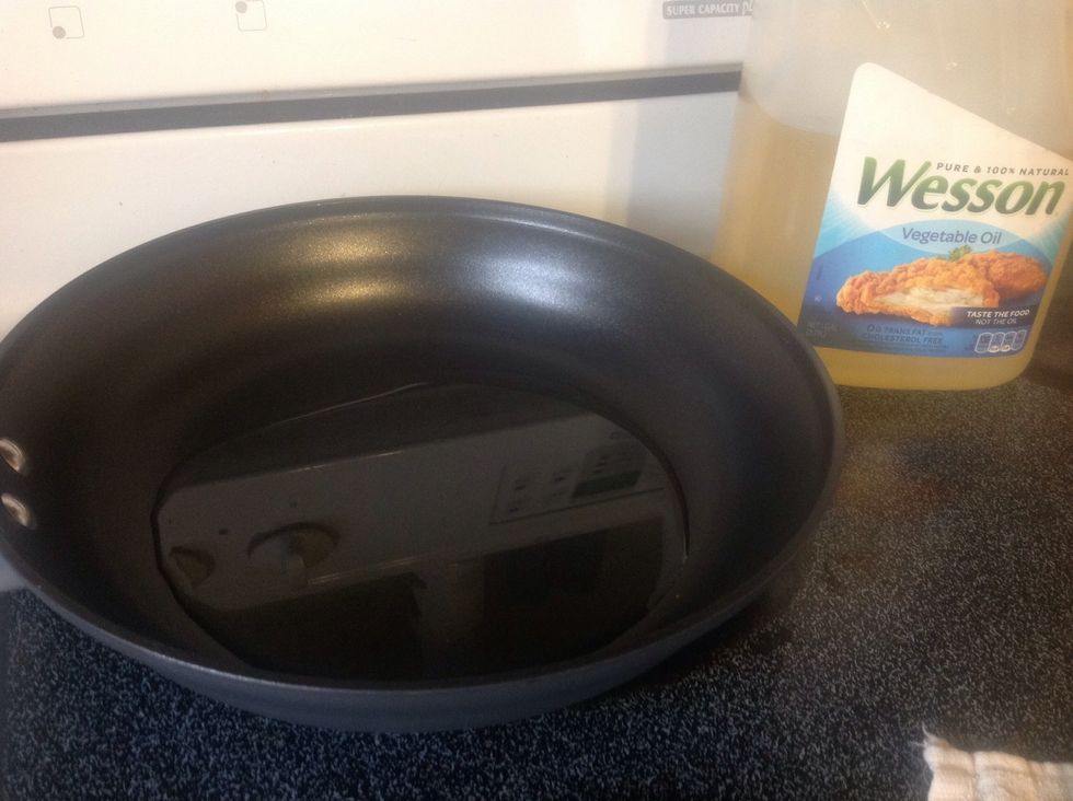 Add vegetable oil to your frying pan so it covers about a 1/4 inch deep.