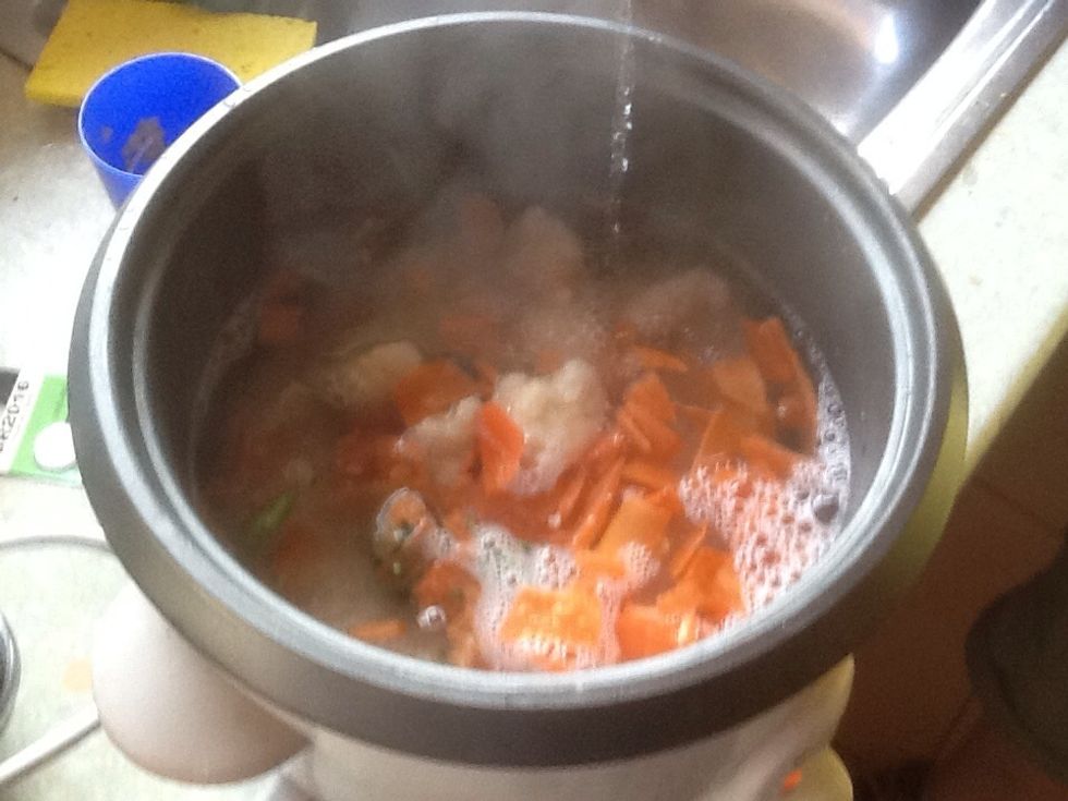 Add vegetables and boiled water.