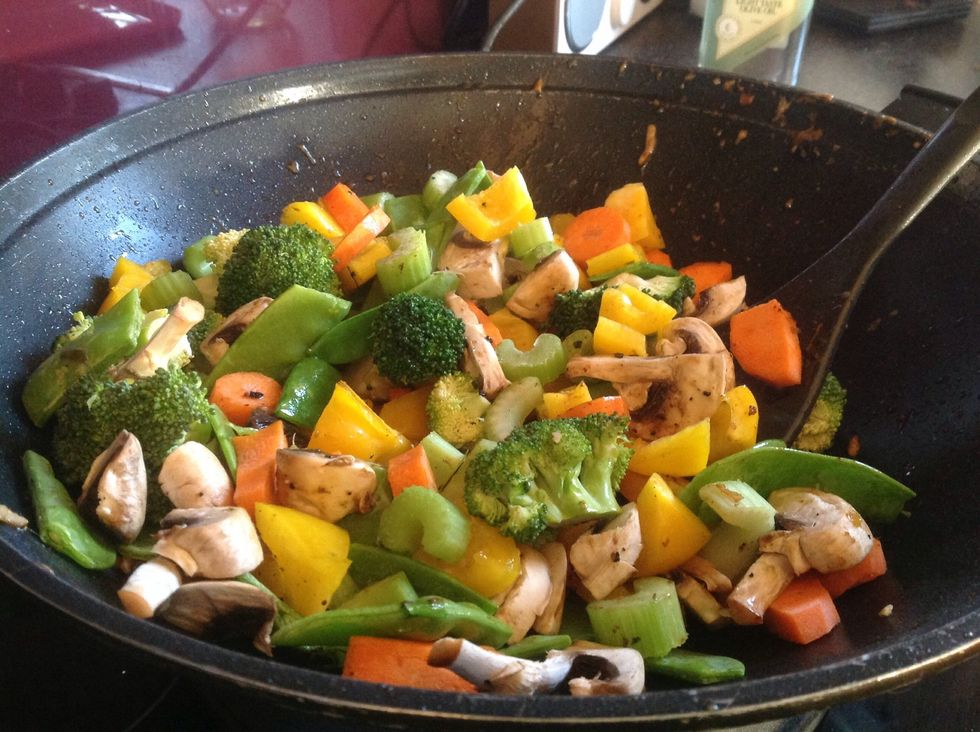 Add vegetables to wok. Cook on high for 10 minutes. Stir regularly.