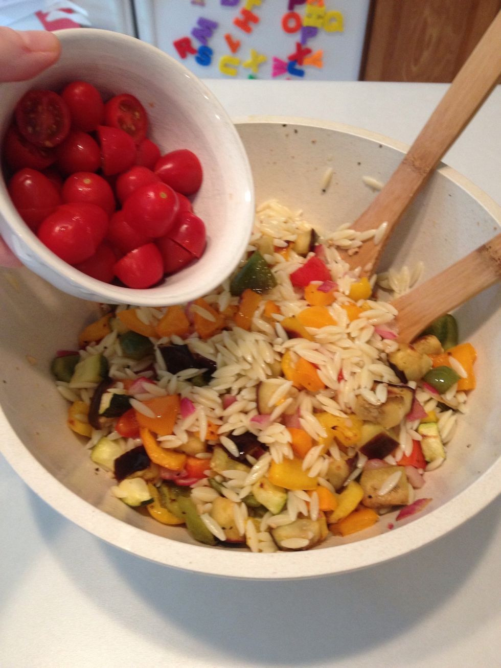 Add veggies to orzo already in serving bowl.  Add tomatoes.