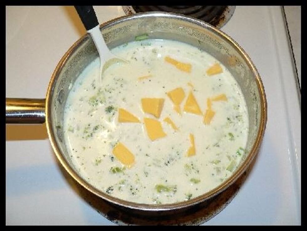 Add Velveeta cheese. Cover and heat until cheese melts. Still keeping heat on low. Never boil. If you want soup cheesier, add more Velveeta. If you want to adjust taste, add more Garlic Powder.