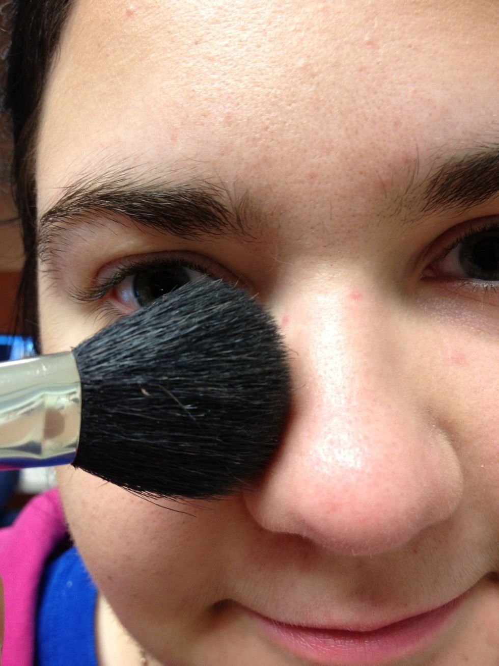 Add very little Bronzer to your mid-forehead, and along the sides of your nose. This will make your nose look smaller.