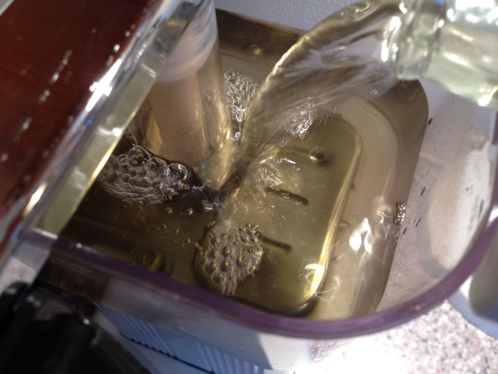 Add vinegar to your coffee machine and turn it on