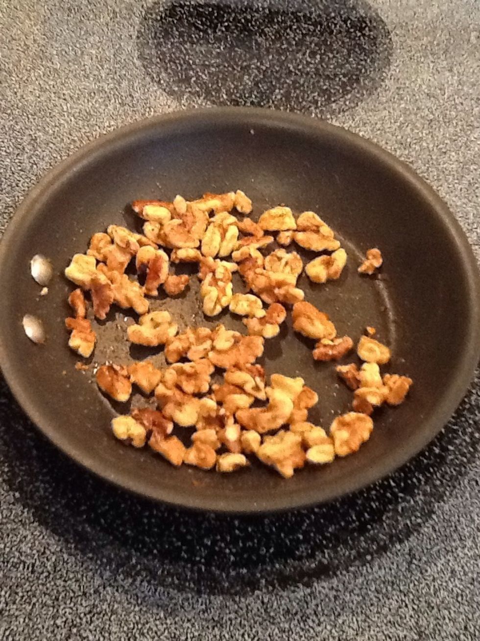 Add walnuts and cook until glazed and browned. Stir constantly and remove from heat when ready so walnuts do not burn.