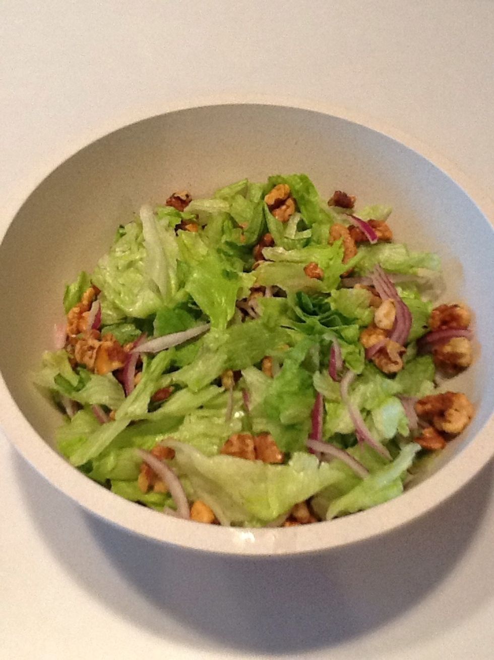 Add walnuts to salad.