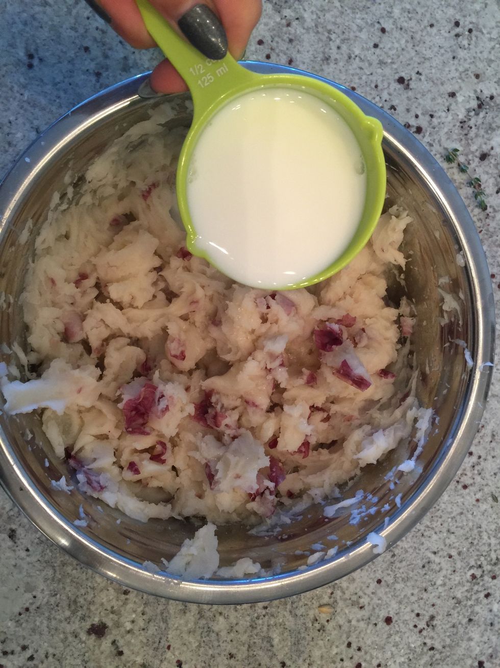 Add warmed milk, salt and oil