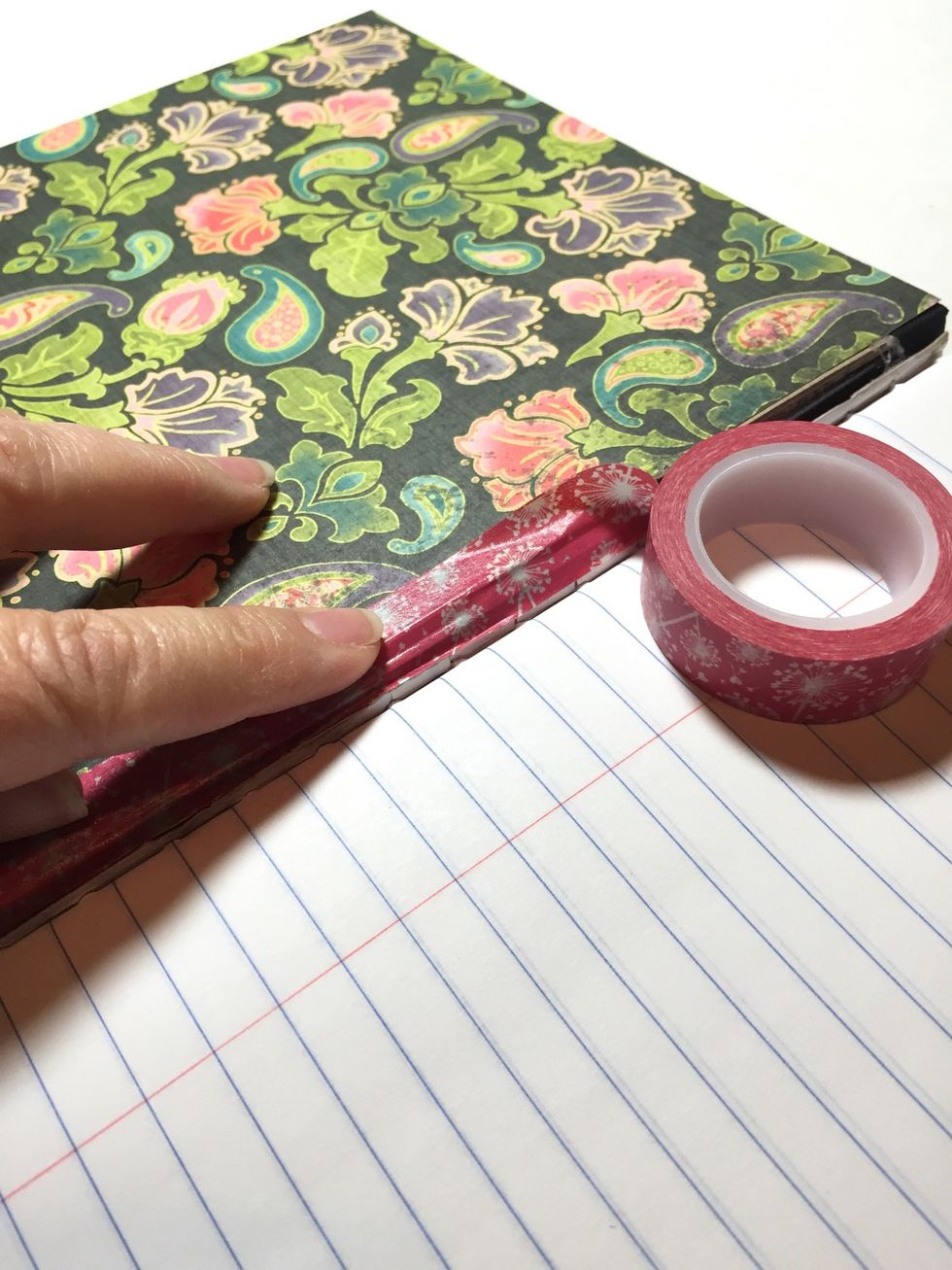 add washi tape along the spine of the inside of your front and back covers to finish off the edges.