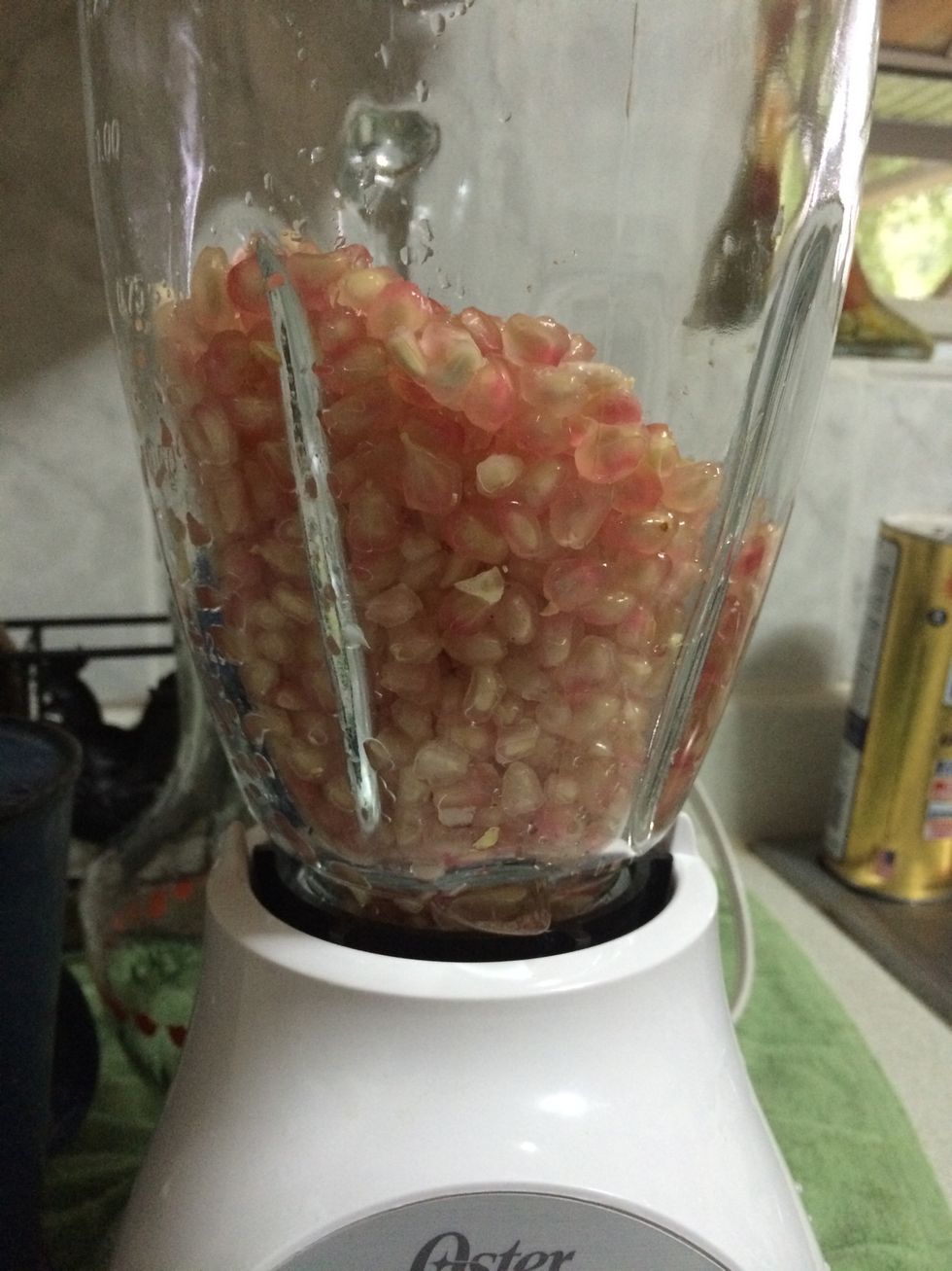 Add water about 1 cup or half cup (depends on how much pomegranates you have). Add sugar or your preference sweetener to your taste.