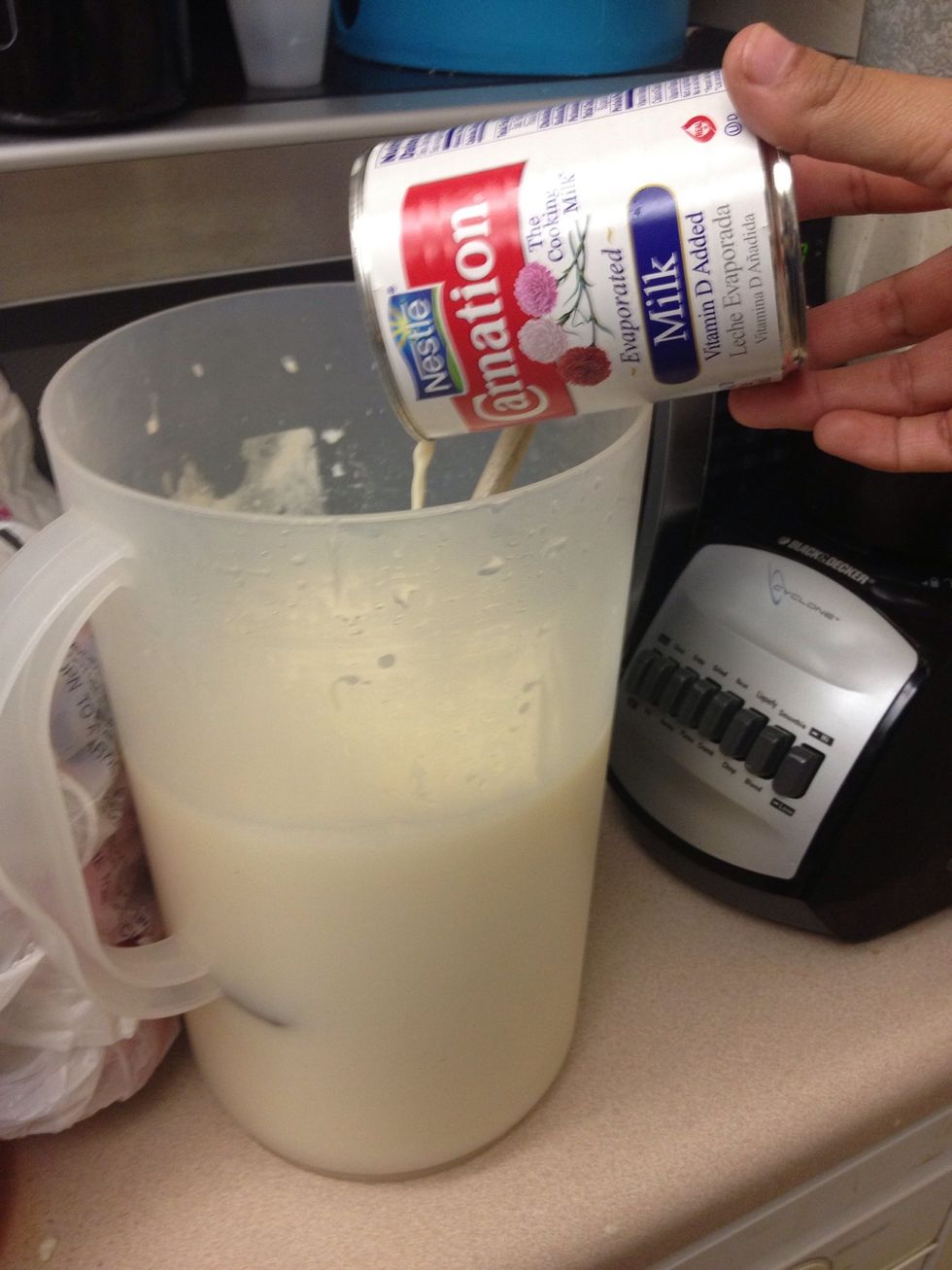 Add water, and a Add can of evaporated milk. Also, add sugar, to taste. I will be adding sweetened condensed milk later, so I don't add as much sugar.