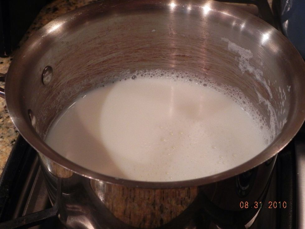Add water and almond milk to stock pot.