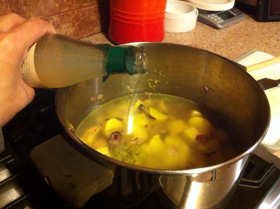 Add water and clam juice. Cover, Increase heat to medium high, and bring to a boil. Allow to boil for 10 minutes.